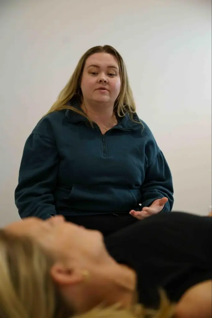 Pelvic health therapist discussing treatment with a patient