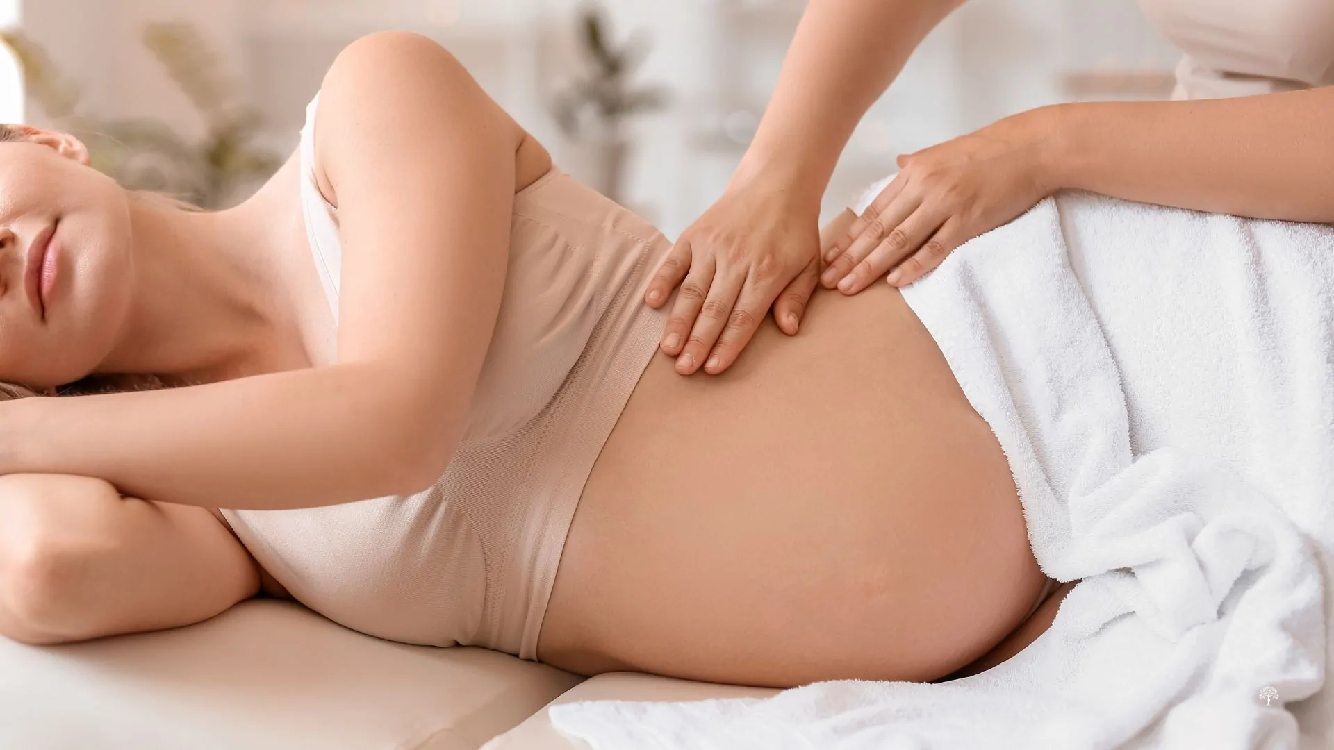 A woman receiving prenatal massage therapy at Taylor PT and Wellness in Winston Salem